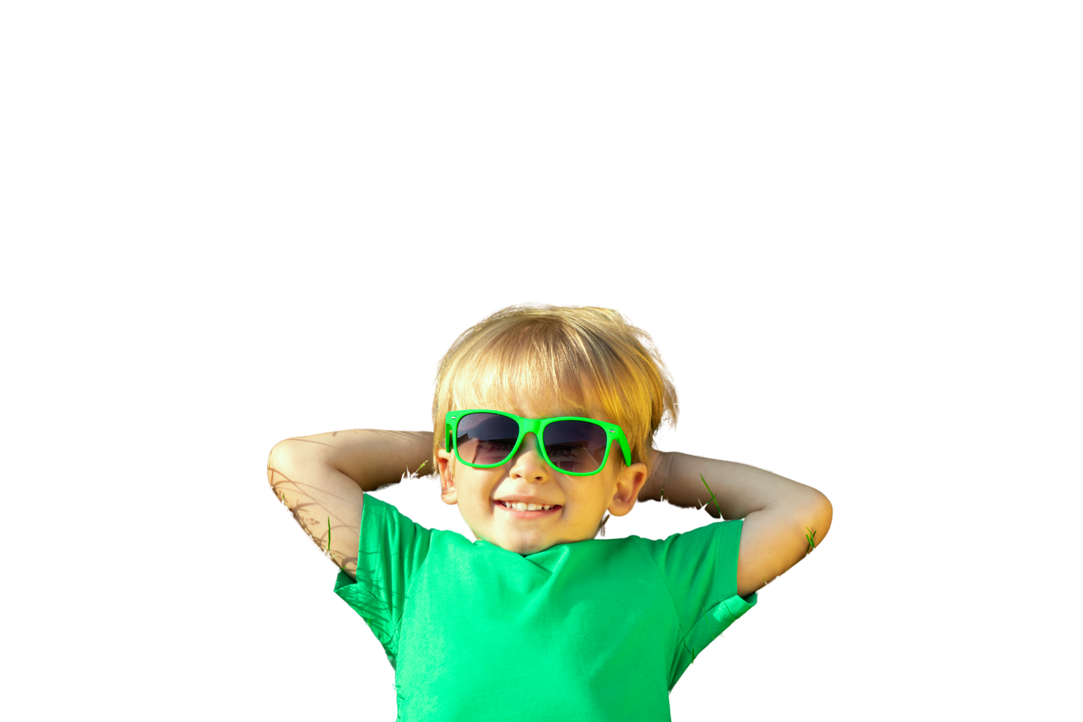 Happy Child Lying on Spring Green Grass